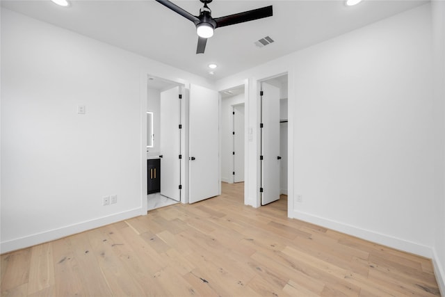 unfurnished bedroom with baseboards, visible vents, recessed lighting, and light wood-type flooring