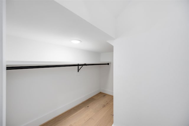 walk in closet featuring light wood finished floors