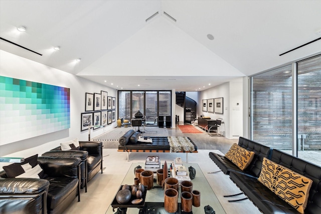 living room featuring plenty of natural light, high vaulted ceiling, and recessed lighting