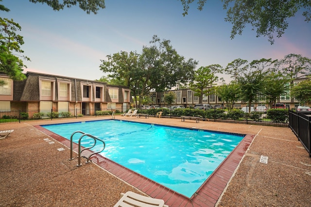 community pool featuring fence