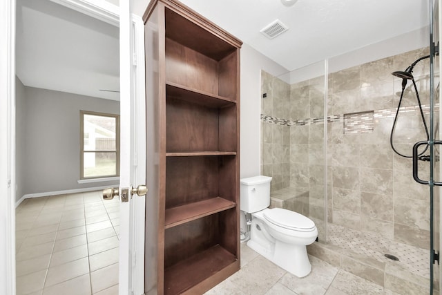 full bath featuring a stall shower, visible vents, toilet, and tile patterned flooring