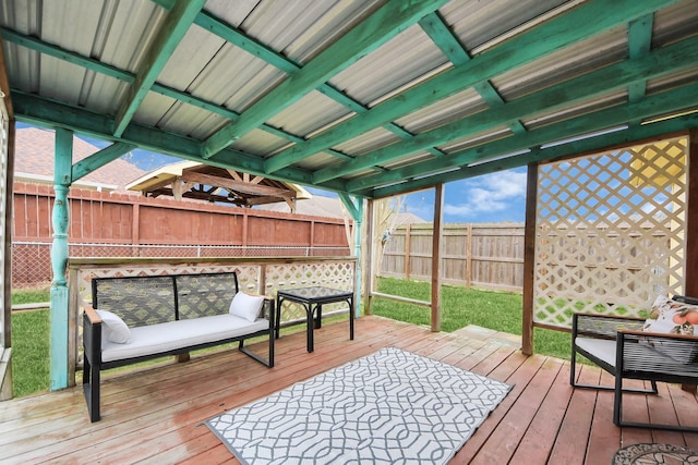 wooden terrace featuring a fenced backyard