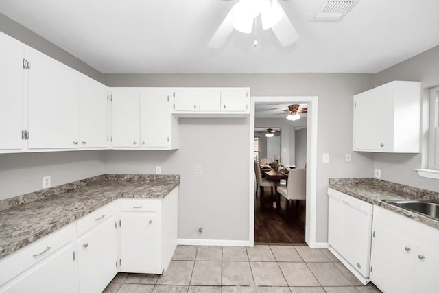 kitchen featuring visible vents, white cabinetry, light tile patterned floors, and white dishwasher