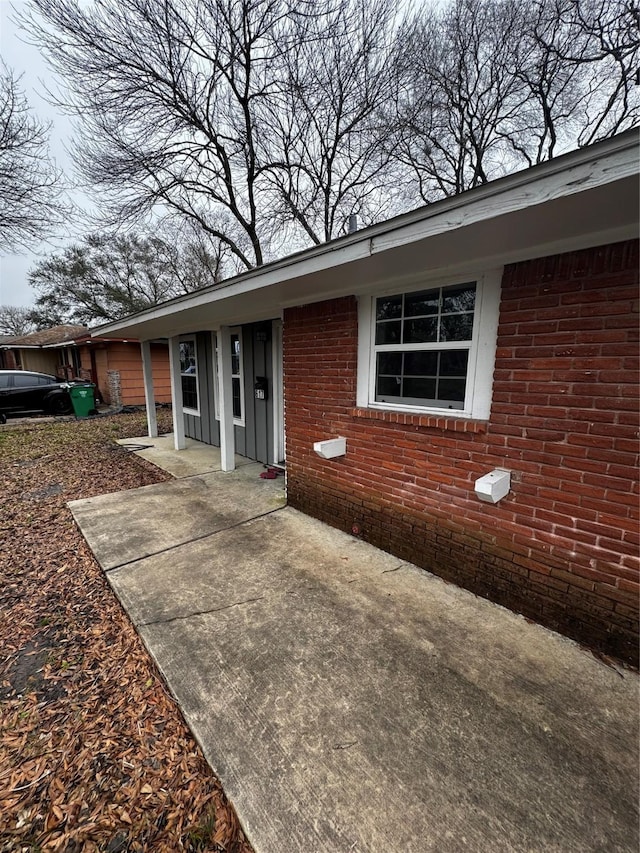 view of front of home featuring brick siding