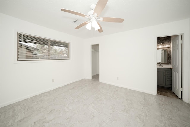 unfurnished bedroom with a sink, ensuite bathroom, visible vents, baseboards, and a closet