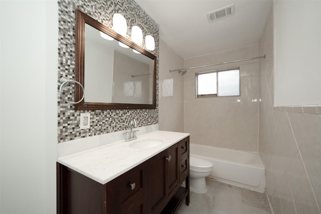 full bath with vanity, tile walls, visible vents, toilet, and shower / washtub combination