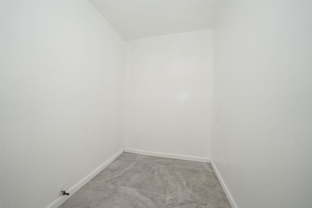 empty room with baseboards