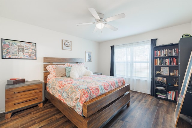 bedroom with dark wood-type flooring and a ceiling fan