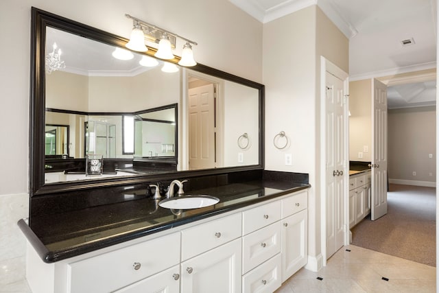 bathroom featuring ornamental molding, visible vents, baseboards, vanity, and tile patterned floors