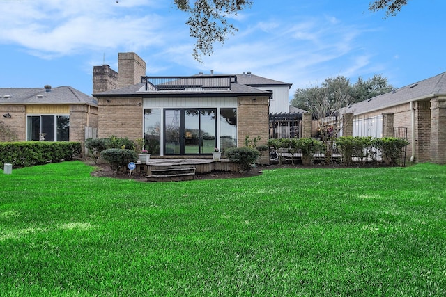 506 Fox Briar Ln, Sugar Land, TX 77478 - rear view of property featuring a yard, brick siding, and a chimney
