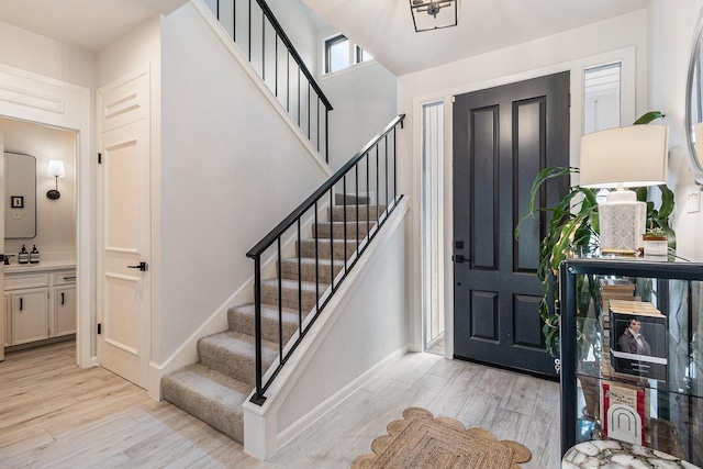 506 Fox Briar Ln, Sugar Land, TX 77478 - entryway featuring light wood-style floors, stairs, and baseboards