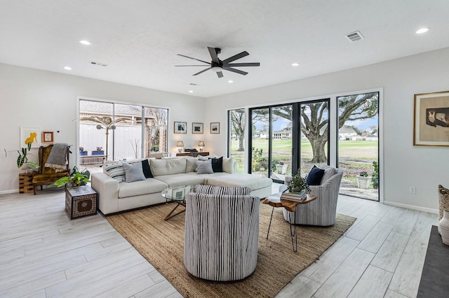 506 Fox Briar Ln, Sugar Land, TX 77478 - living area with light wood finished floors, ceiling fan, recessed lighting, and baseboards