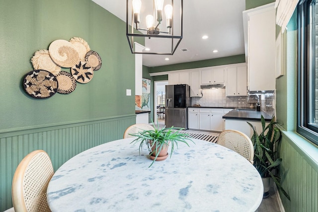 506 Fox Briar Ln, Sugar Land, TX 77478 - dining area featuring a chandelier, wainscoting, and recessed lighting