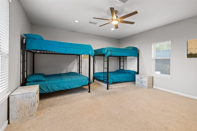 bedroom featuring recessed lighting, visible vents, baseboards, light carpet, and ceiling fan