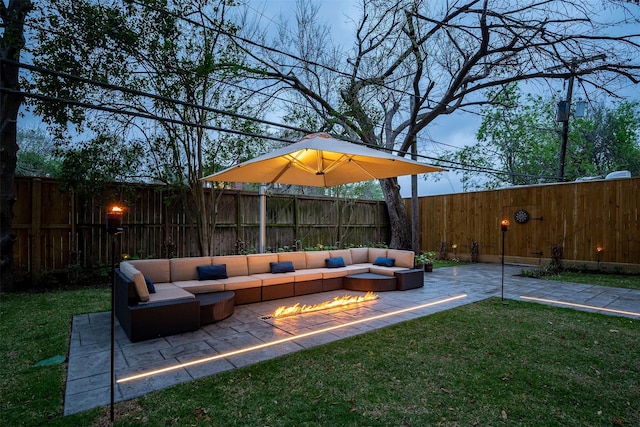 exterior space with an outdoor living space with a fire pit, a fenced backyard, and a patio