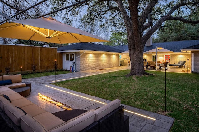 exterior space with fence, an outdoor structure, an outdoor hangout area, and a patio