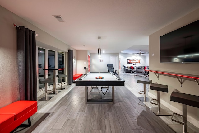 rec room featuring baseboards, wood finished floors, visible vents, and pool table