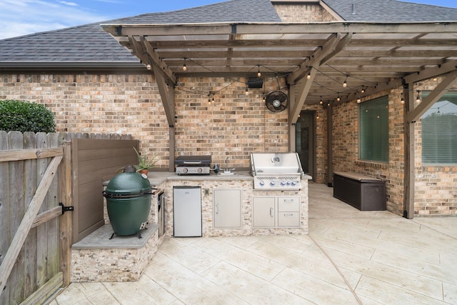 view of patio / terrace featuring area for grilling and fence