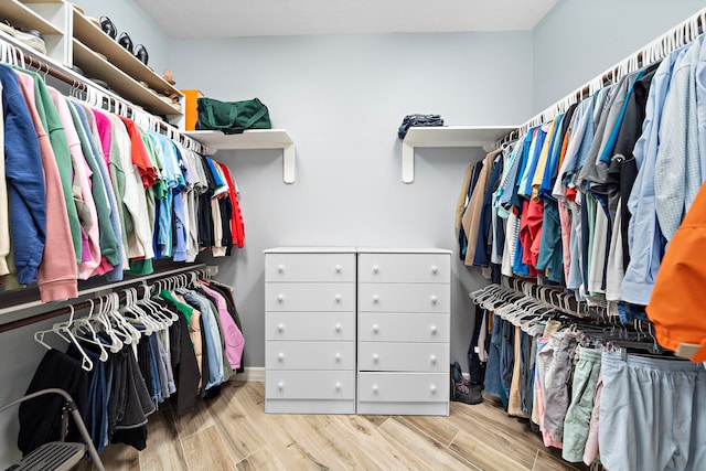 spacious closet featuring light wood-type flooring