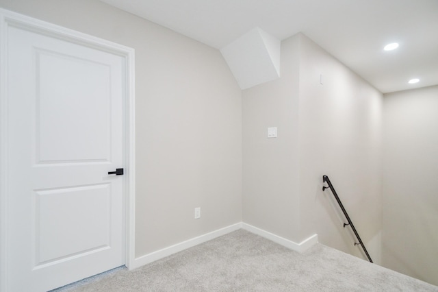 interior space with baseboards, recessed lighting, and light colored carpet