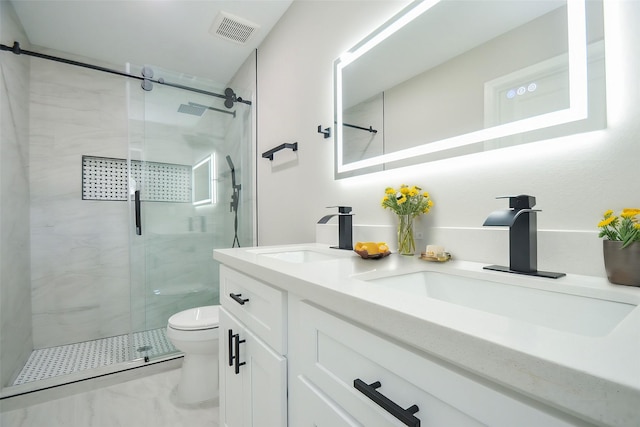 bathroom with a sink, visible vents, toilet, and double vanity