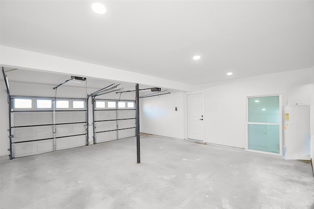 garage featuring recessed lighting and a garage door opener