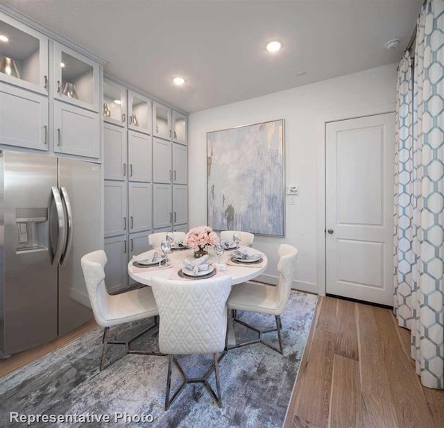 dining area featuring recessed lighting and dark wood-type flooring