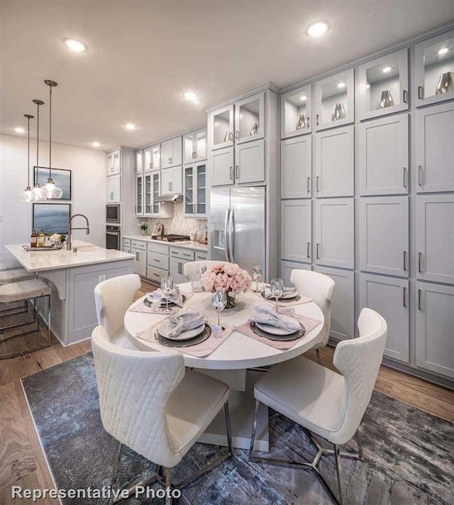 dining room featuring dark wood-type flooring and recessed lighting