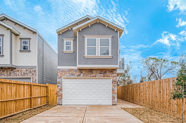 9418 Madera Rd, Houston, TX 77078 - view of front of property with stone siding, concrete driveway, and stucco siding