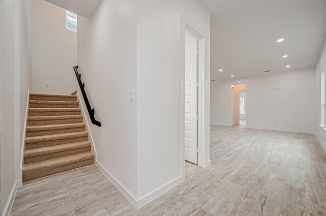 9418 Madera Rd, Houston, TX 77078 - stairs featuring wood finished floors, recessed lighting, and baseboards