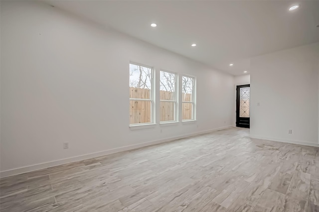 9418 Madera Rd, Houston, TX 77078 - spare room with light wood finished floors, recessed lighting, and baseboards