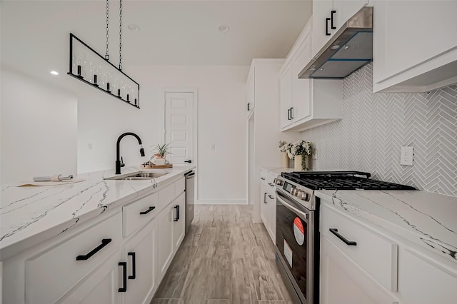 9418 Madera Rd, Houston, TX 77078 - kitchen featuring stainless steel appliances, under cabinet range hood, a sink, light stone countertops, and tasteful backsplash