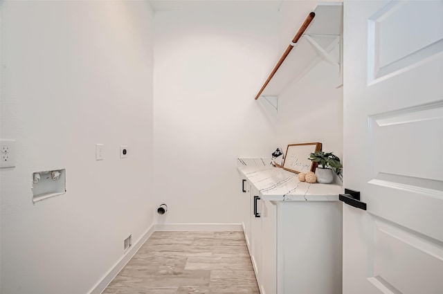 9418 Madera Rd, Houston, TX 77078 - washroom with hookup for an electric dryer, baseboards, and washer hookup