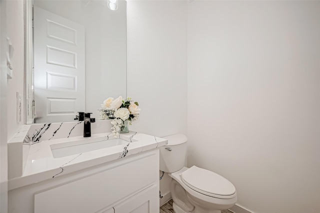 9418 Madera Rd, Houston, TX 77078 - bathroom featuring baseboards, toilet, and vanity