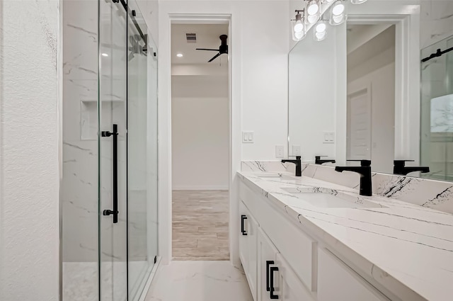 9418 Madera Rd, Houston, TX 77078 - full bath with a marble finish shower, marble finish floors, a ceiling fan, and double vanity
