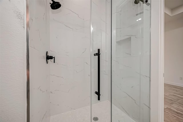 9418 Madera Rd, Houston, TX 77078 - full bath with a marble finish shower and wood finished floors