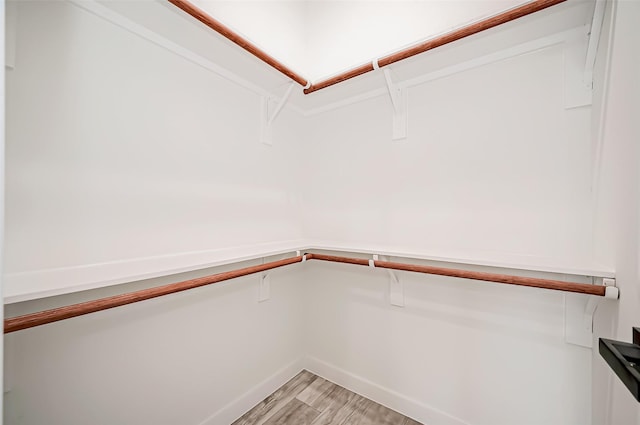 9418 Madera Rd, Houston, TX 77078 - walk in closet featuring light wood-type flooring