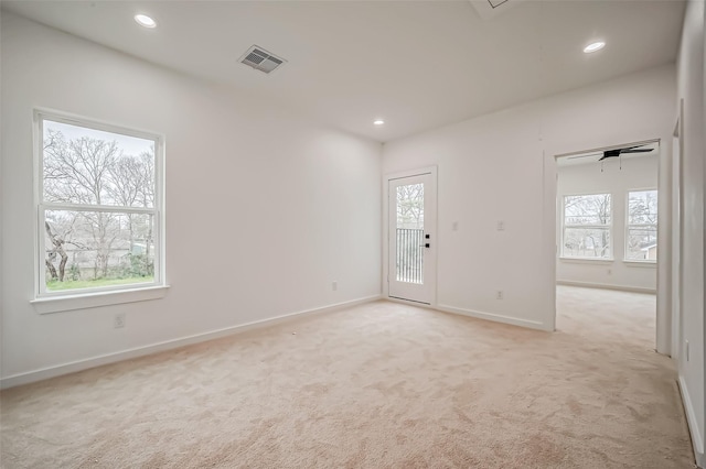 9418 Madera Rd, Houston, TX 77078 - empty room with plenty of natural light, light colored carpet, and recessed lighting