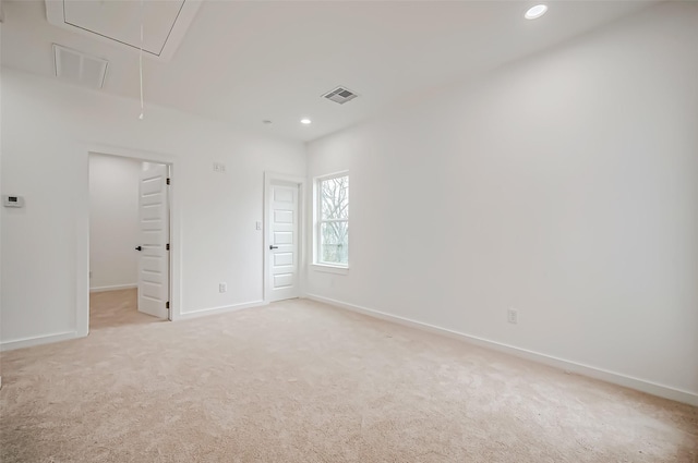 9418 Madera Rd, Houston, TX 77078 - spare room with attic access, light colored carpet, recessed lighting, and baseboards