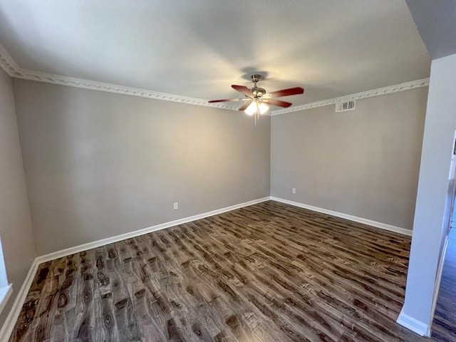 unfurnished room featuring ceiling fan, visible vents, baseboards, dark wood-style floors, and crown molding