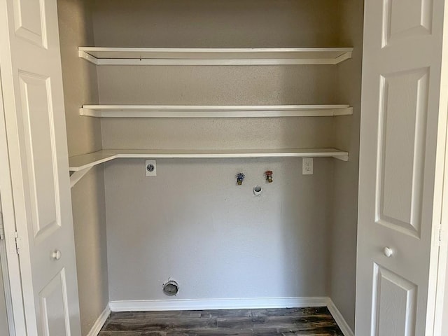 laundry area featuring laundry area, baseboards, dark wood-style floors, and electric dryer hookup