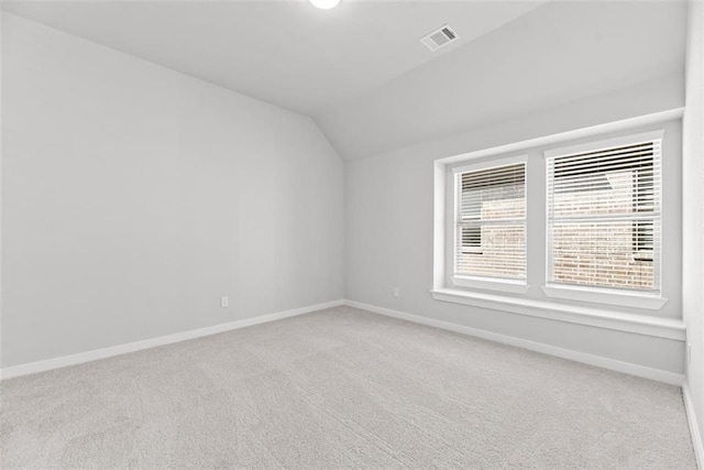 2666 Woodforest Pkwy N, Montgomery, TX 77316 - unfurnished room with lofted ceiling, visible vents, baseboards, and carpet floors