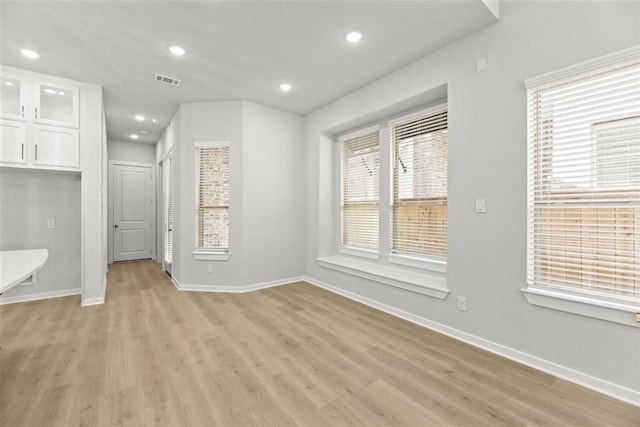 2666 Woodforest Pkwy N, Montgomery, TX 77316 - unfurnished dining area featuring recessed lighting, visible vents, baseboards, and light wood-style floors