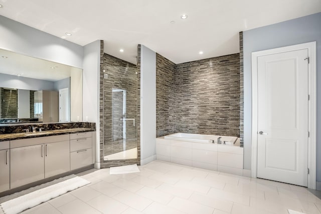 full bath featuring vanity, recessed lighting, a shower stall, a bath, and tile patterned flooring