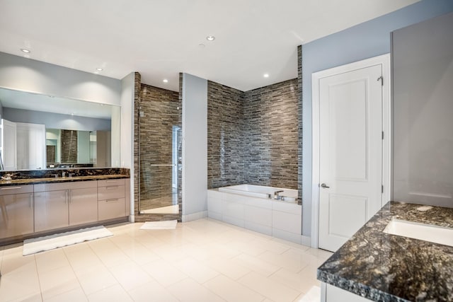 full bathroom with vanity, a garden tub, recessed lighting, and a stall shower