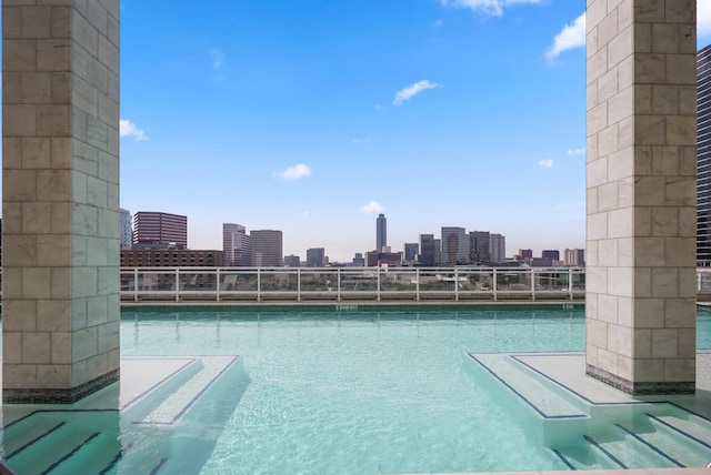 community pool featuring a view of city