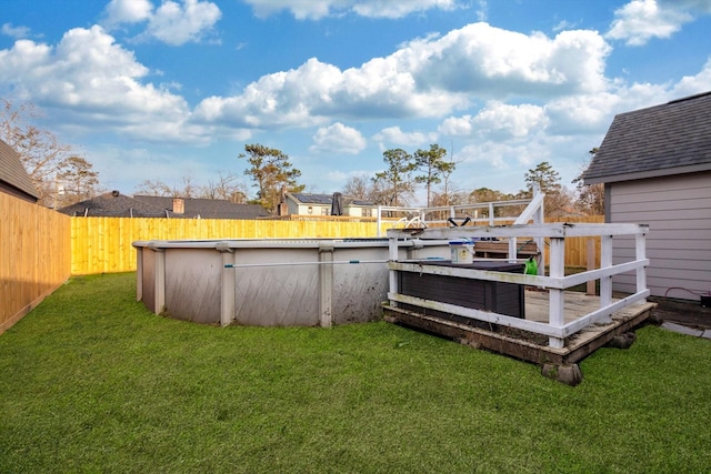 view of yard with a fenced backyard and a fenced in pool