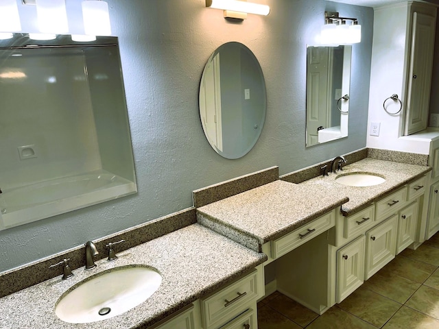 bathroom with tile patterned flooring and vanity