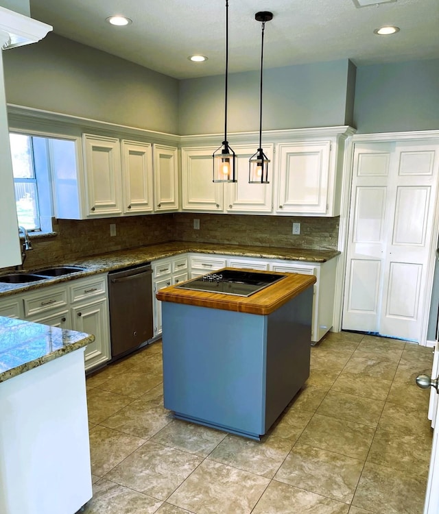 kitchen with decorative light fixtures, white cabinetry, a kitchen island, a sink, and dishwasher