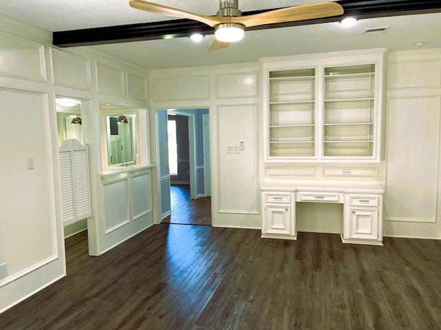 interior space featuring visible vents, ceiling fan, dark wood-style flooring, a decorative wall, and built in desk